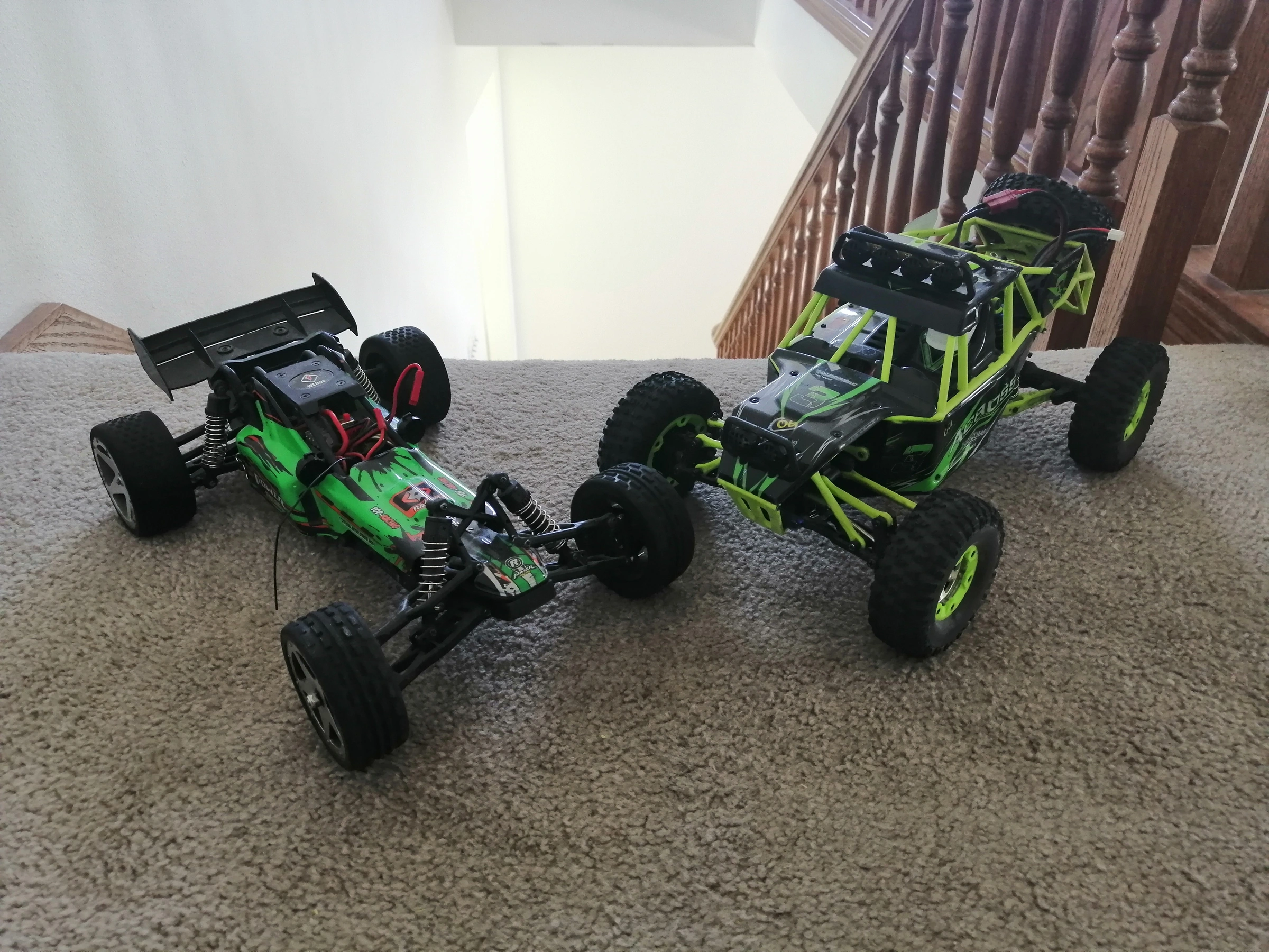 My remote-control cars, including a vehicle with its body removed.
